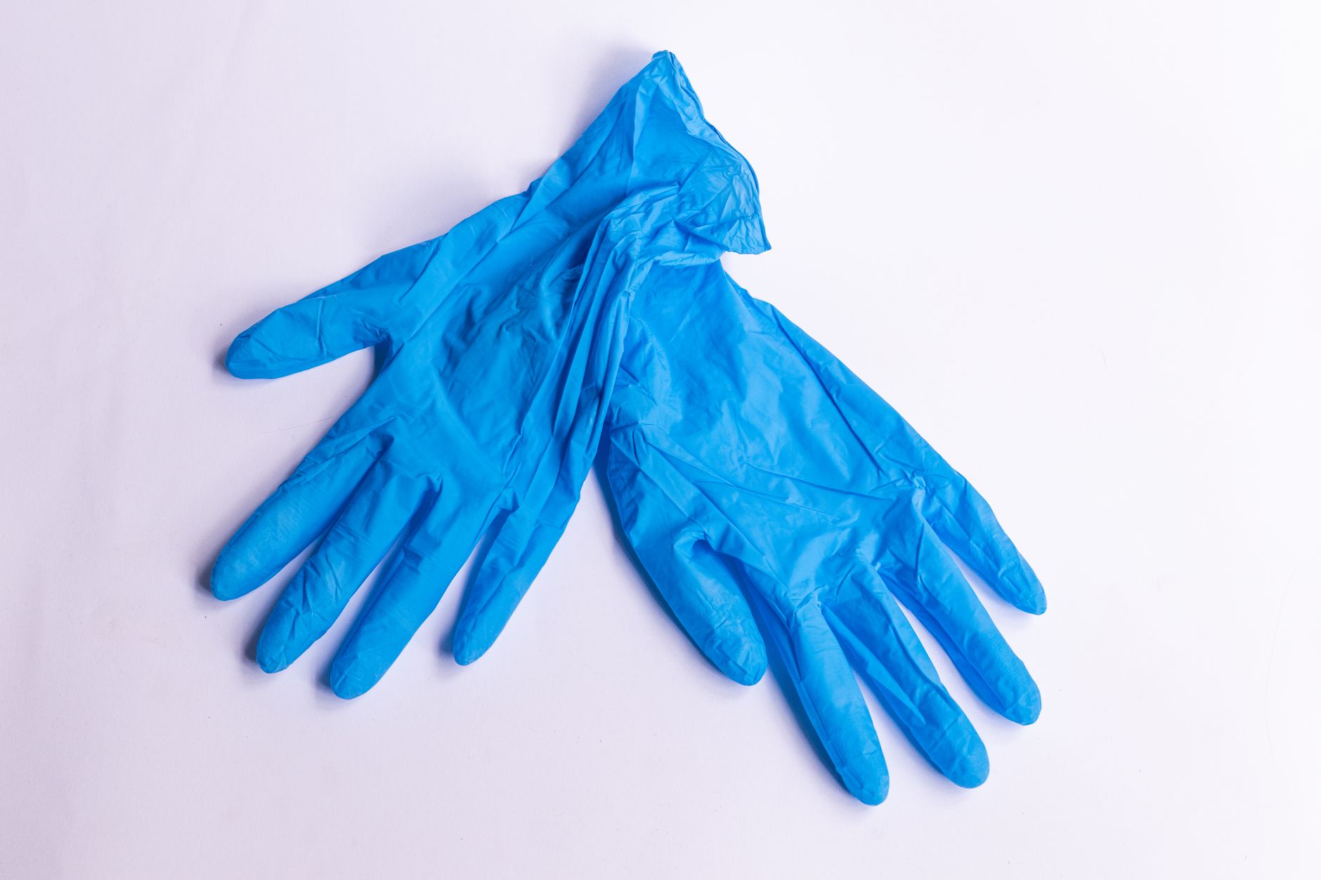 Pair of blue nitrile examination gloves